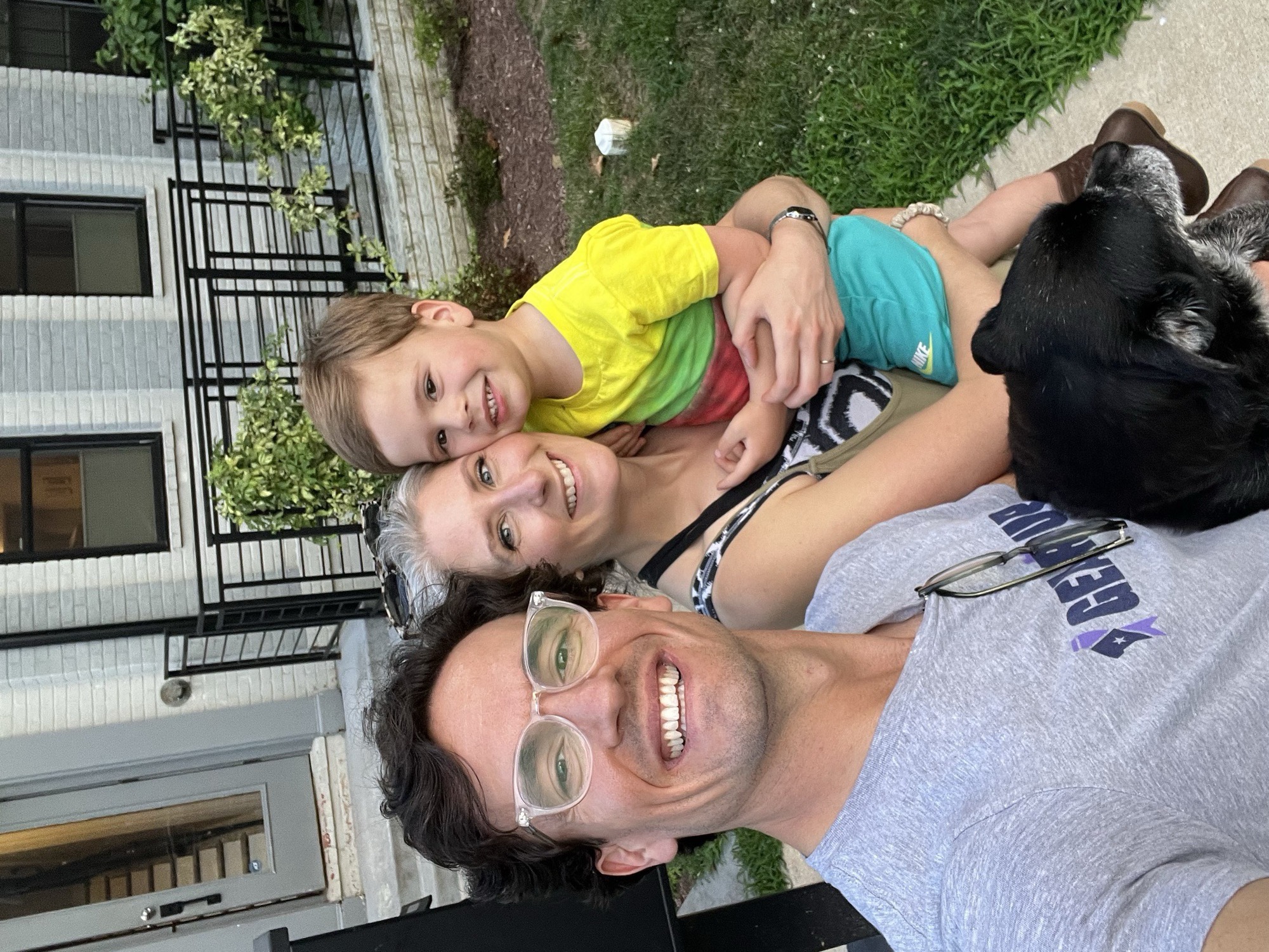 The team on the front steps: Preston, Liza, George, and Franklin the dog, piled together for a selfie